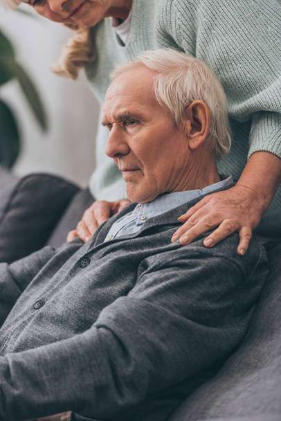 stock-photo-cropped-view-retired-wife-embrace